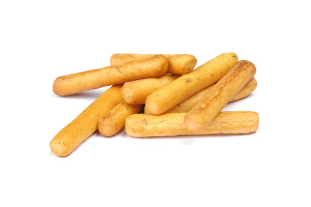 heap-of-wheat-bread-sticks-with-spices-isolated-on-a-white-background